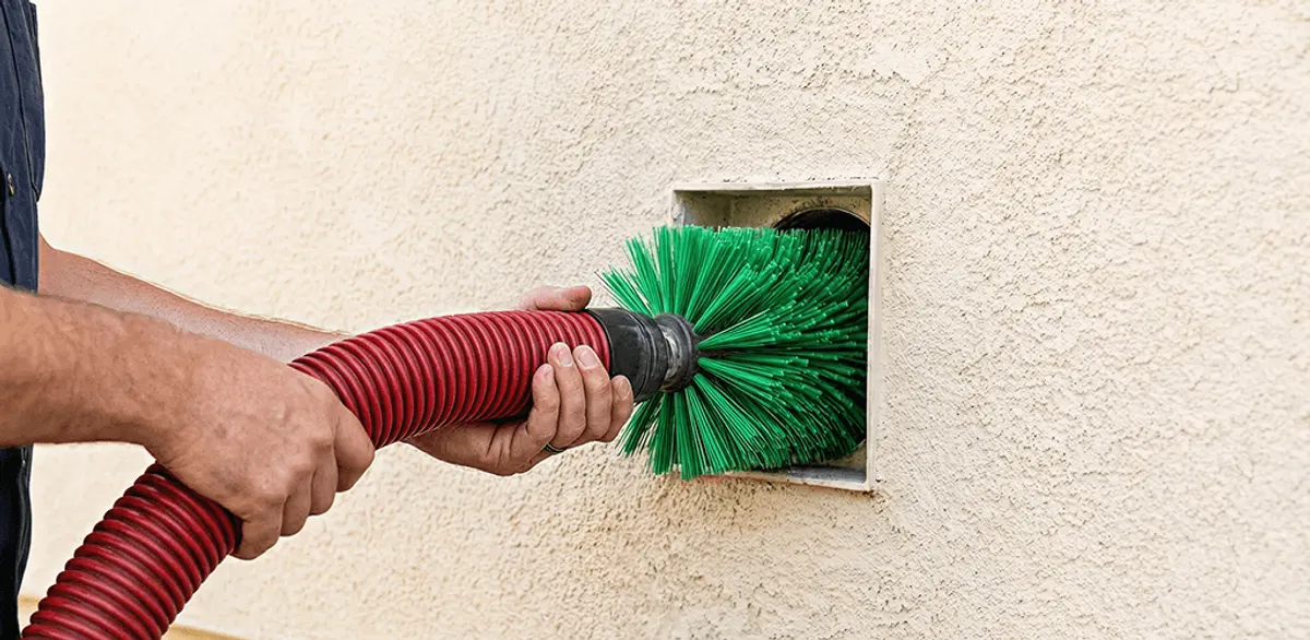 Air duct cleaning brush removing debris from a vent opening in Portland, OR