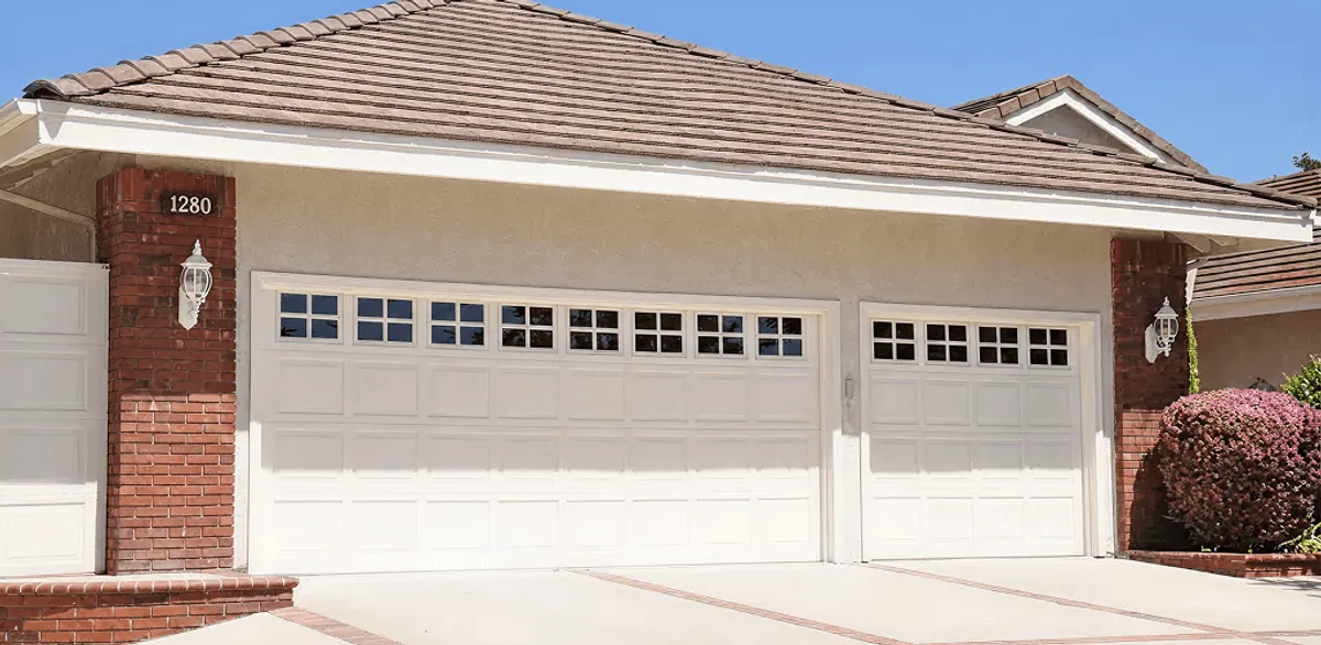 Residential garage door repair service for a double garage door in Portland, OR